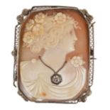 A large Art Deco carved shell cameo portrait brooch of a classical lady in profile, around her