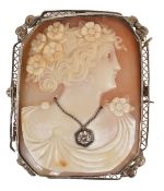 A large Art Deco carved shell cameo portrait brooch of a classical lady in profile, around her