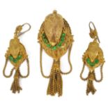 A striking high Victorian gilt Pinchbeck and emerald paste brooch and earrings. The brooch of high