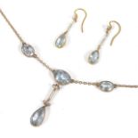 An Edwardian aquamarine pendant chain necklace having central tear shaped aquamarine suspended by