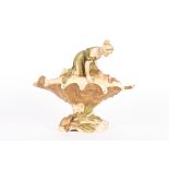 A Royal Dux bisque porcelain figure of a maiden atop a large conch shell realistically modelled, the