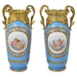 A pair of late 19th century French porcelain Sevres style vases with ormolu mounts the powder blue