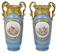 A pair of late 19th century French porcelain Sevres style vases with ormolu mounts the powder blue