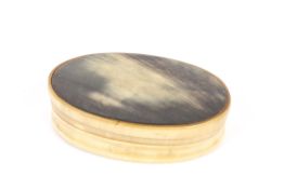 A simple Georgian oval polished horn two piece gentleman's box 9 cm diameter Condition: Overall