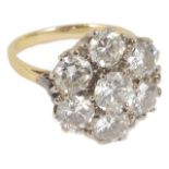 A large seven stone diamond circular cluster dress ring, the stones approx. weight 0.50ct each,