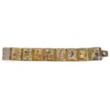 A Persian painted mother of pearl articulated panel bracelet, each rectangular panel painted with
