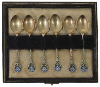 A cased set of six George V silver gilt and enamel spoons hallmarked Birmingham 1937 by T & S, the