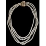 A four strand graduated cultured pearl necklace having 9ct gold garnet and pearl set fancy clasp.