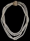 A four strand graduated cultured pearl necklace having 9ct gold garnet and pearl set fancy clasp.