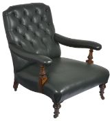 A Victorian oak button back library armchair, with dark green leather upholstered back, seat and