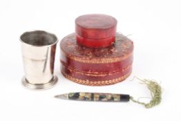 A tooled leather jewellery box together with a cased collapsible cup in a leather case, and a