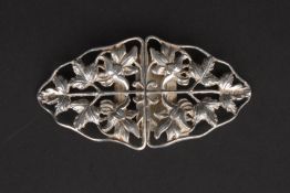 An Edwardian silver nurses buckle hallmarked Birmingham 1902, pierced and decorated with flowers.