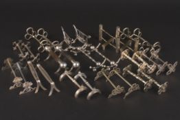 A collection of assorted pairs of silver plated knife rests Condition: