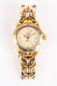 A ladies Tag Heuer Professional gold plated wrist watch the cream dial with luminous markers and