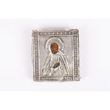 A small Russian .84 silver icon of a saint hallmarked and initialled BC and dated 1865. 5.25 x 4.