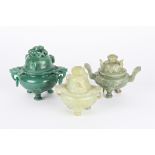 A group of three modern Chinese jade and hardstone koros and covers each with carved decoration, two