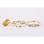 A gold and diamond five stone ring set with central old cut diamond weighing approx. 0.13cts flanked