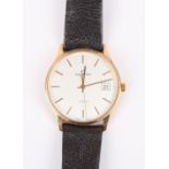 A Garrard 9ct gold Quartz wrist watch the silvered dial with baton numerals and date aperture,