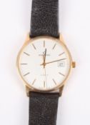 A Garrard 9ct gold Quartz wrist watch the silvered dial with baton numerals and date aperture,