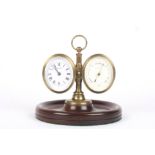 A barometer and clock desk piece the oval shaped clock and brass aneroid barometer mounted onto a