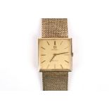 An Omega de Ville 9ct gold mechanical wrist watch with square gilded dial and baton numerals, the 17