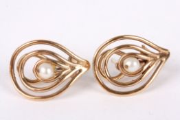 A pair of 9ct gold and seed pearl earrings of teardrop form, each set with a single pearl. Maker: