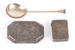 A silver vesta case and a silver seal spoon together with a white metal pill box with embossed