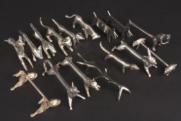 A collection of pairs of silver plated novelty animal knife rests including dogs, rabbits and