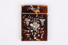 A tortoiseshell calling card case with applied mother-of-pearl floral spray, with silver coloured