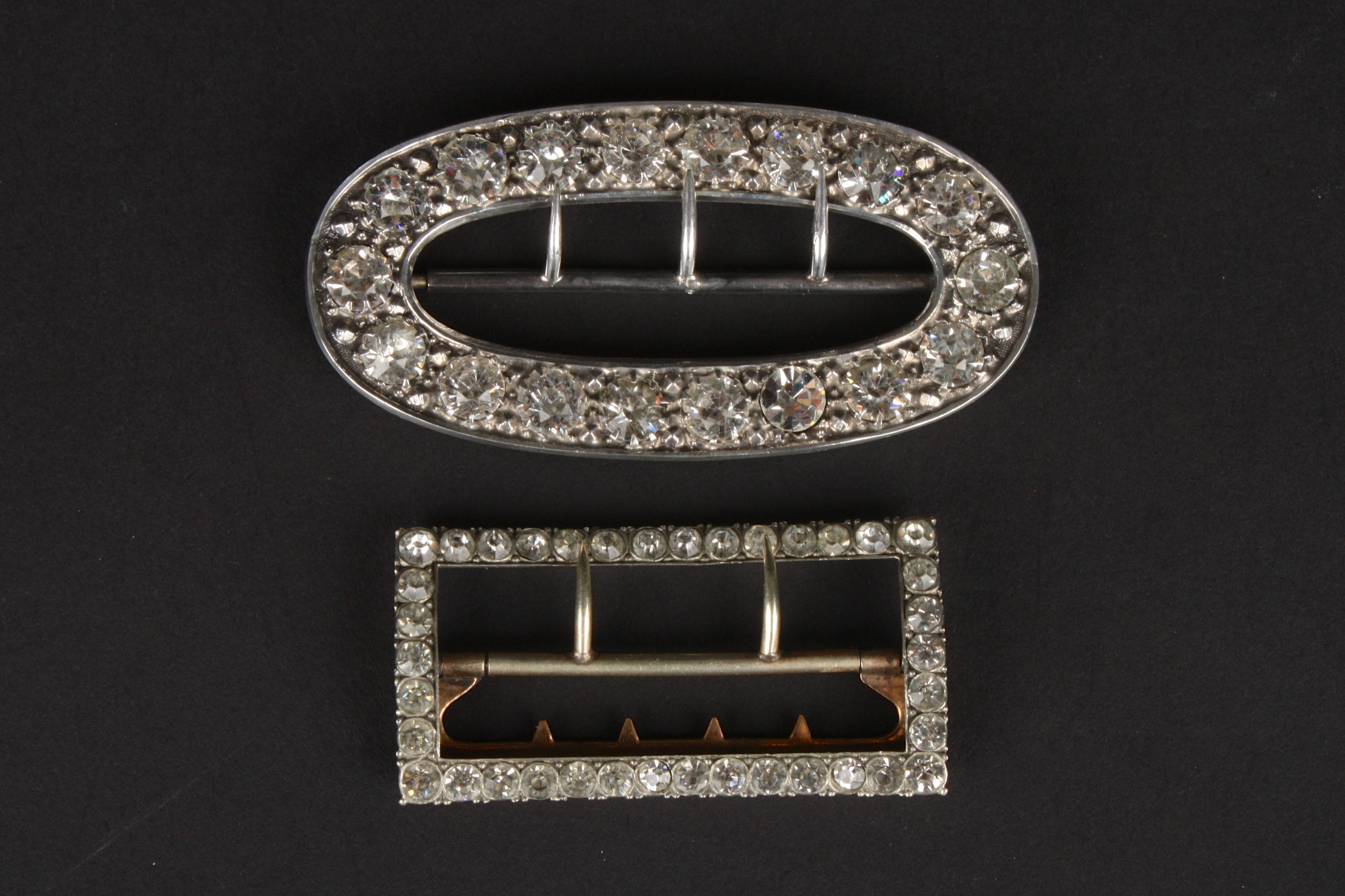 A Chester silver oval belt buckle set with paste stones, hallmarked 1899, and another buckle. (2)