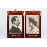 A pair of early 20th century Art Nouveau photograph frames containing photos of the King and Queen