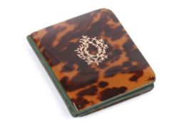 An Edwardian blonde tortoiseshell wallet with green leather interior, the front applied with a