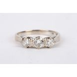 A three stone diamond set ring 18ct white gold mount the centre stone weight approx. 0.25 ct. Size