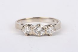 A three stone diamond set ring 18ct white gold mount the centre stone weight approx. 0.25 ct. Size