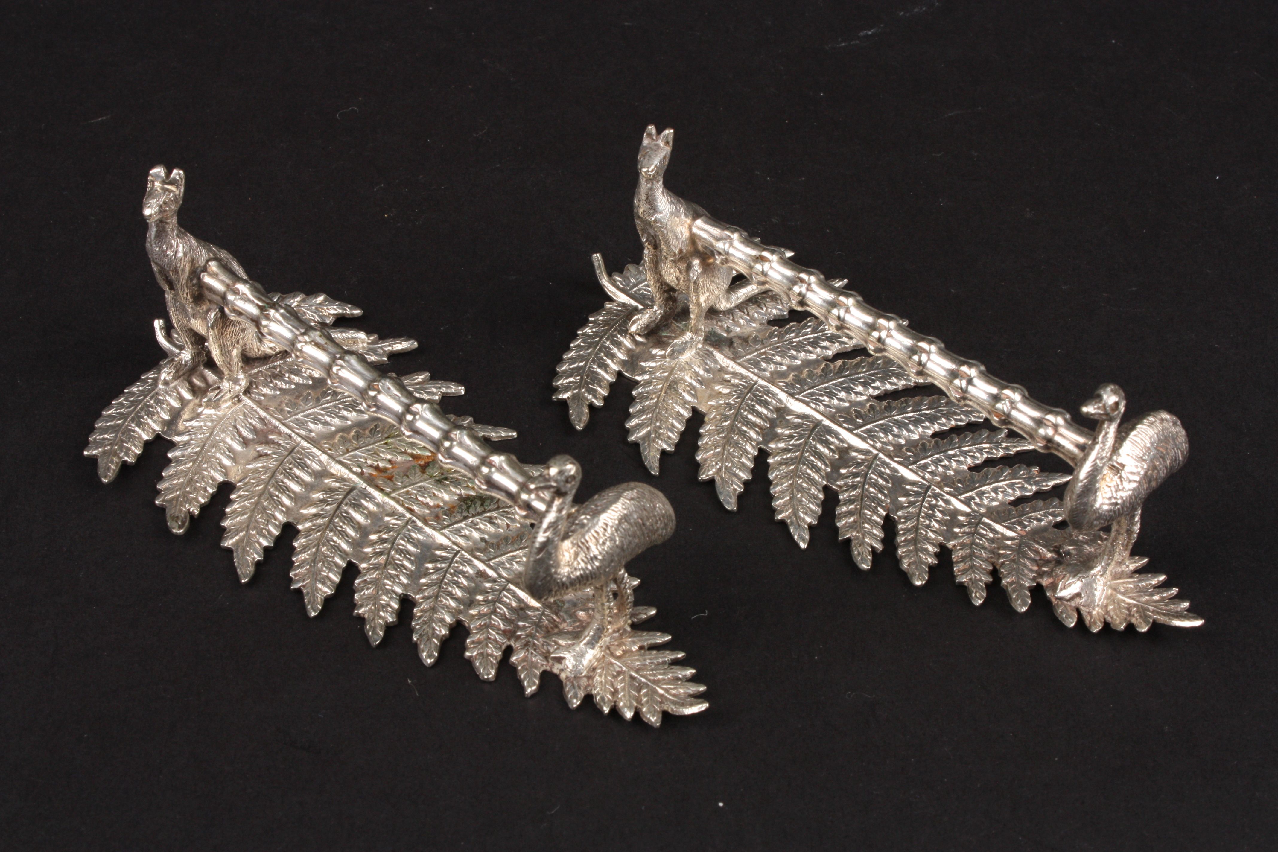 A pair of silver plated Kangaroo and emu knife rests with fern bases. Condition: Good condition.