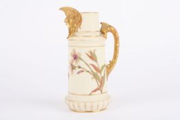 A Royal Worcester ivory ground jug, decorated with flowers and mask mount, puce mark and numbered