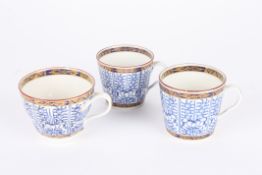 Two 18th century Worcester Royal Lily blue and white coffee cans and a matching tea cup. (3)