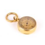 A Victorian yellow metal miniature fob barometer the gilded dial with engraved decoration, black