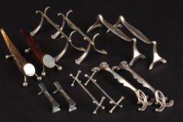 A collection of silver and silver plated knife rests including 4 silver pairs and 2 silver plated