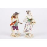 Two 20th century Meissen porcelain figures of a boy and girl the boy with a basket of grapes on