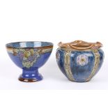 A Royal Doulton blue glazed jardiniere decorated with stylised flowers, together with a Doulton
