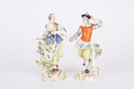 A pair of 20th century Meissen porcelain figures of a dancing man and woman both wearing colourful