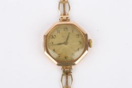 A 1920s 9ct gold ladies Rolex wrist watch the engine turned silvered dial with Arabic numerals set