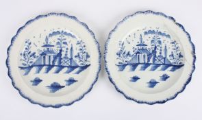 A pair of 18th Century English blue and white pearl ware plates decorated in chinoiserie style