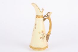 A Royal Worcester ivory ground tapering jug, decorated with flowers and with floral handle, puce