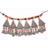 An unusual tribal necklace possibly Tibetan of white metal pierced dropped panels and beads