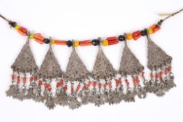 An unusual tribal necklace possibly Tibetan of white metal pierced dropped panels and beads