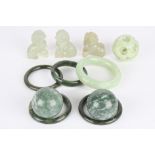 A group of assorted modern Chinese jade and hardstone comprising three carved dogs of foe, two