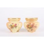 A small pair of Royal Worcester blush ivory lobed vases decorated with flowers, puce mark and