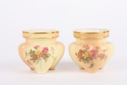 A small pair of Royal Worcester blush ivory lobed vases decorated with flowers, puce mark and